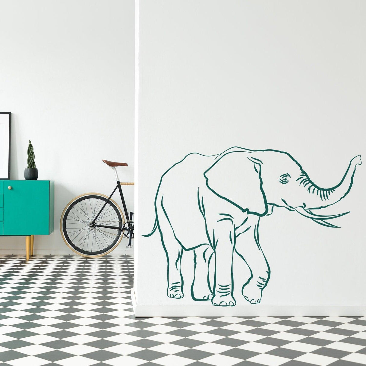 Cute elephant vinyl wall decal on a stylish interior wall, adding whimsy to the room decor.