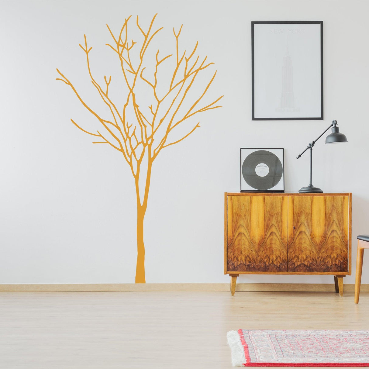 Birch tree wall decal in orange color, enhancing modern nursery decor with nature-inspired design.