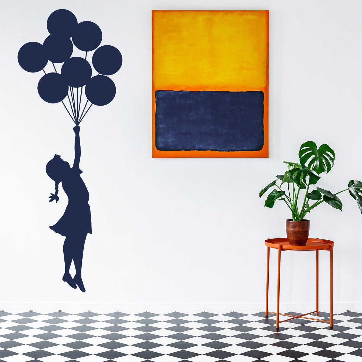 Balloon Girl Banksy vinyl wall sticker in nursery with colorful art and plants decorating the room.