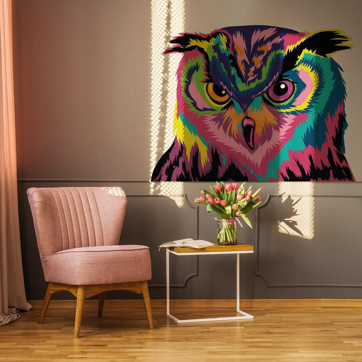 Colorful owl wall sticker decor above a pink chair and table, adding whimsy to the room.