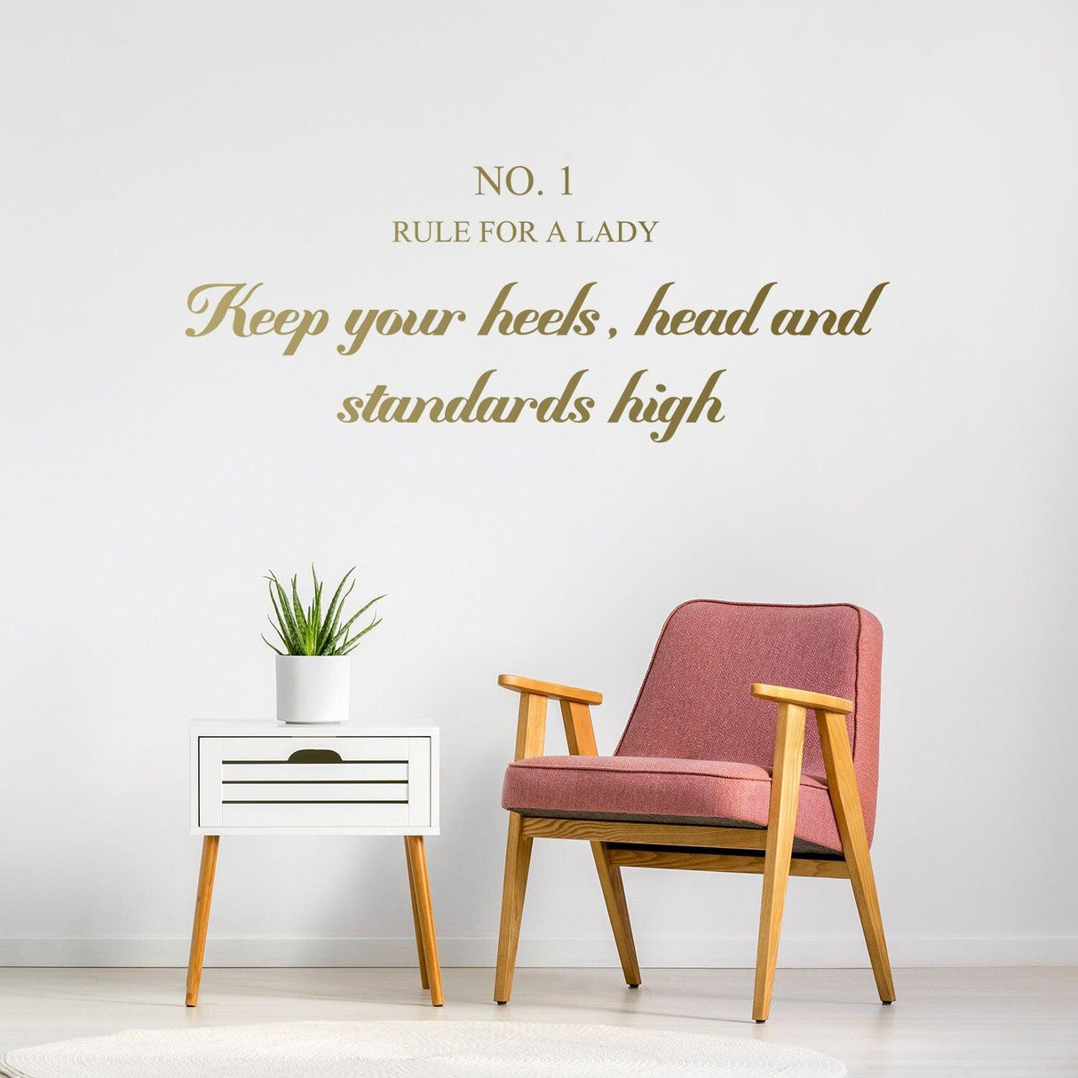 Wall sticker with 'Rule For A Lady' and 'Keep your heels, head, and standards high' in stylish font above a chair.