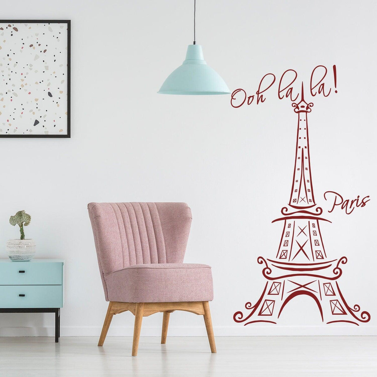 Eiffel Tower wall sticker in a stylish interior with pink chair and decor, showcasing Parisian charm.