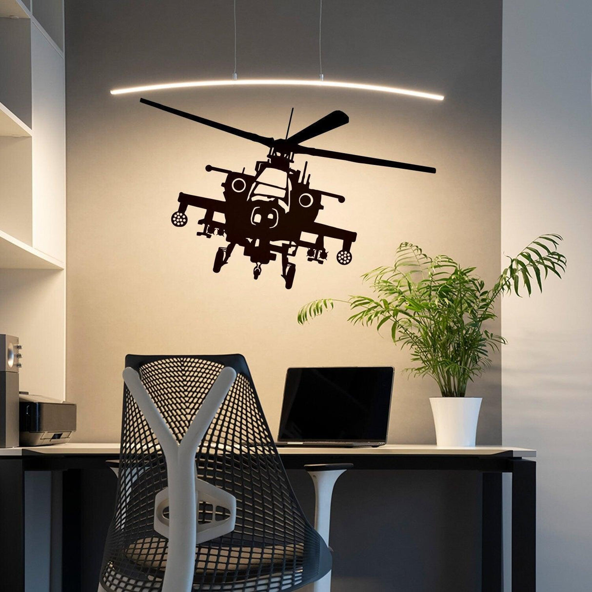 Black helicopter wall sticker above a modern workspace with a sleek chair and plant.