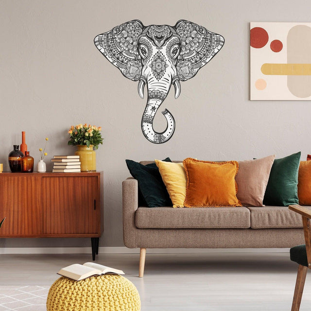 Tribal elephant wall sticker in a stylish living room with colorful cushions and modern decor.
