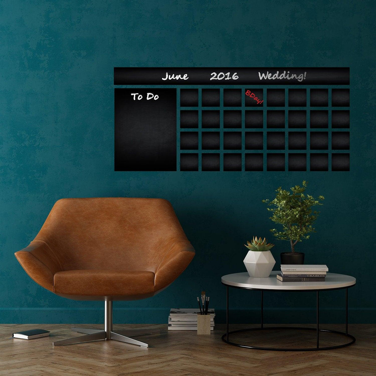 Office calendar chalkboard vinyl sticker on wall above a modern chair, showcasing a customizable organizer for schedules.