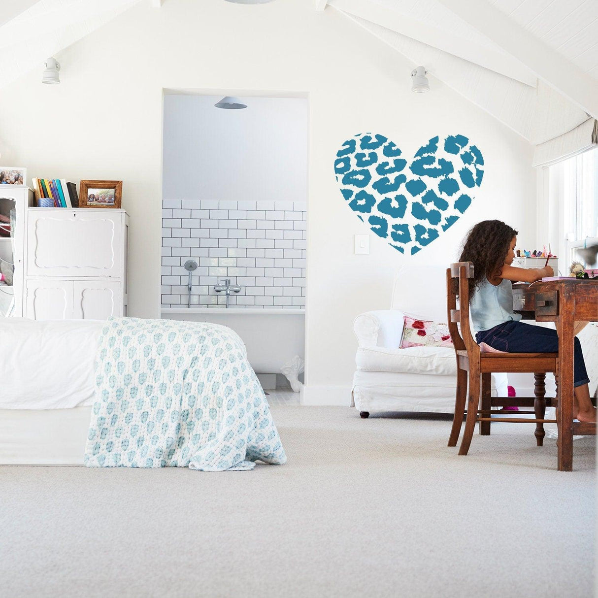 Leopard heart wall sticker in modern bedroom decor, featuring intricate blue leopard print on white walls.