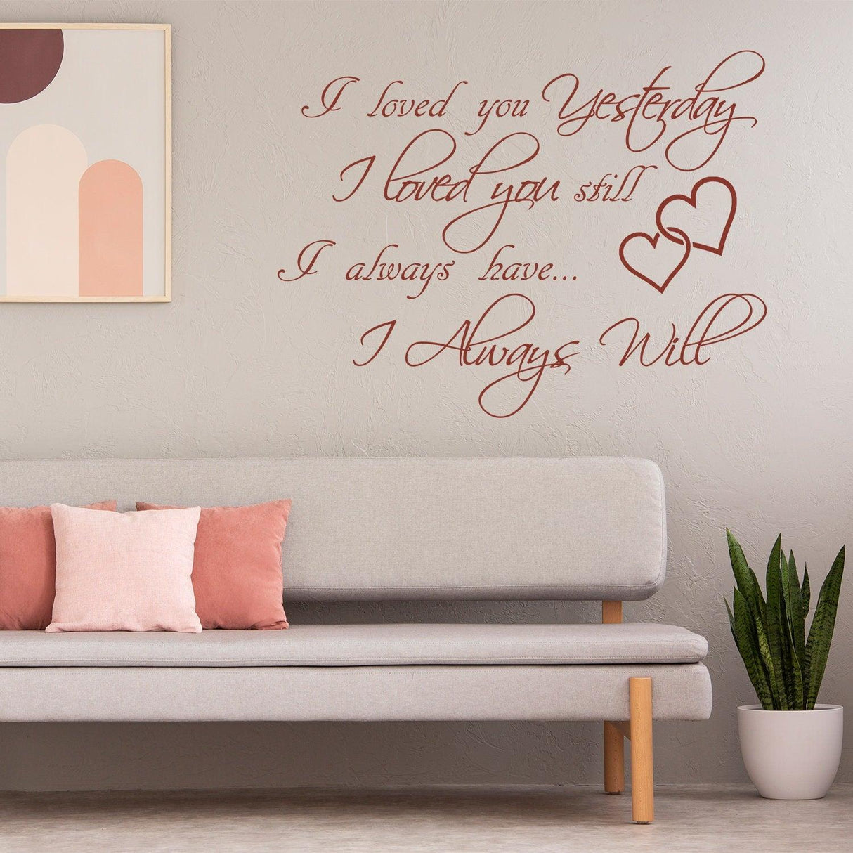 I Love You Yesterday wall sticker with cursive font above a modern sofa, featuring hearts and expressive quotes.