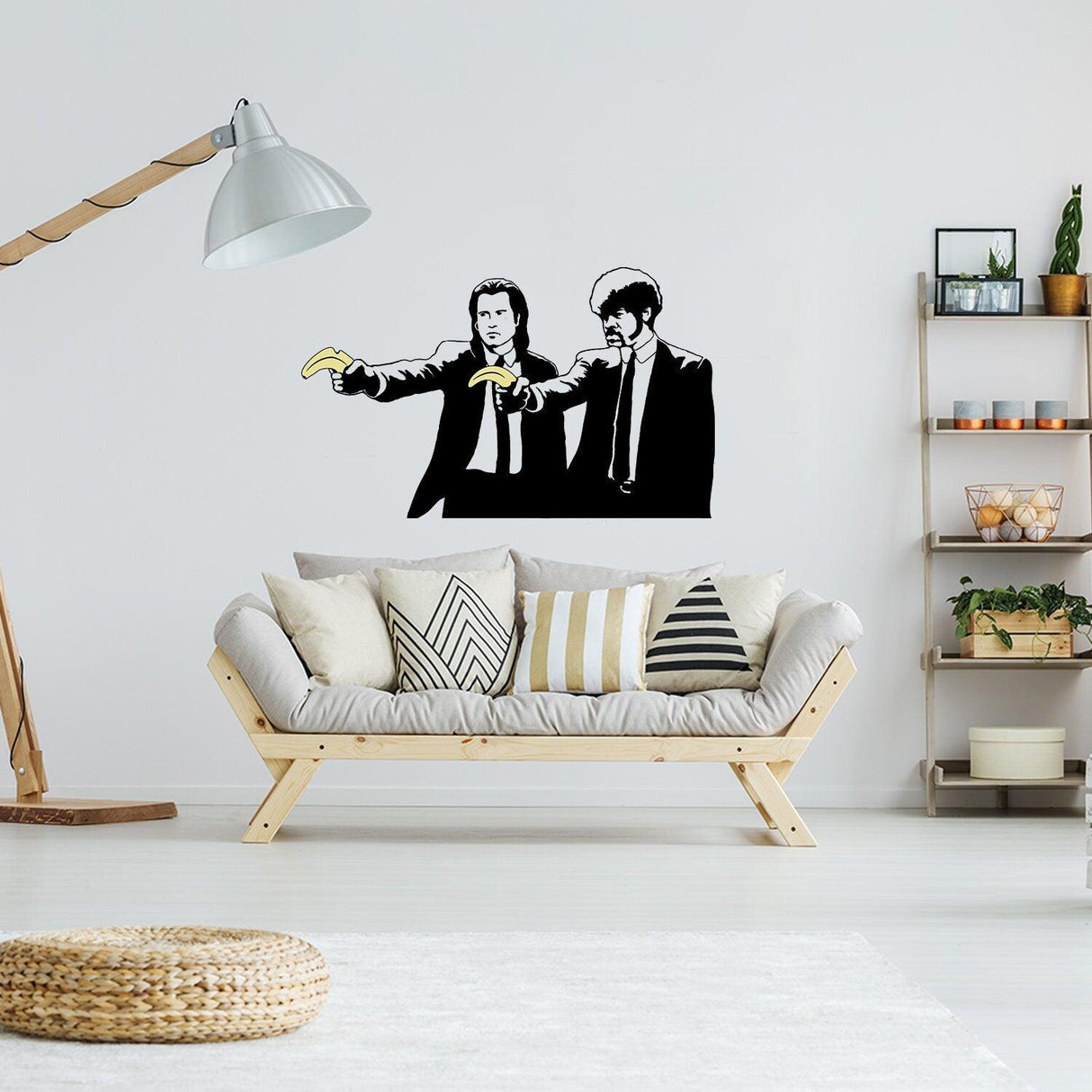 Banksy Pulp Fiction sticker depicting two characters with bananas, adding urban art to a modern living room decor.