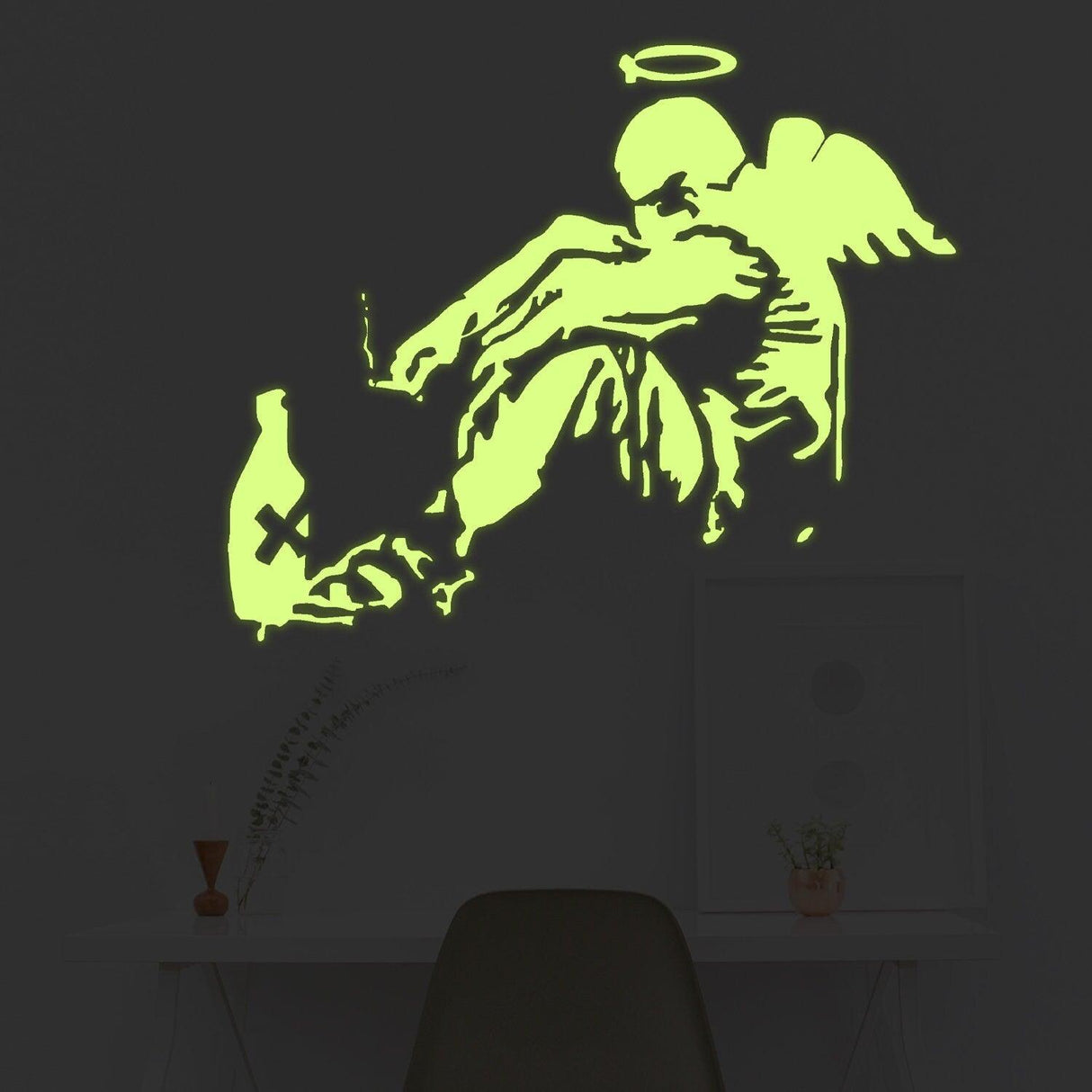 Glow in the dark Banksy fallen angel wall sticker showcasing glowing wings in a contemporary room decor.