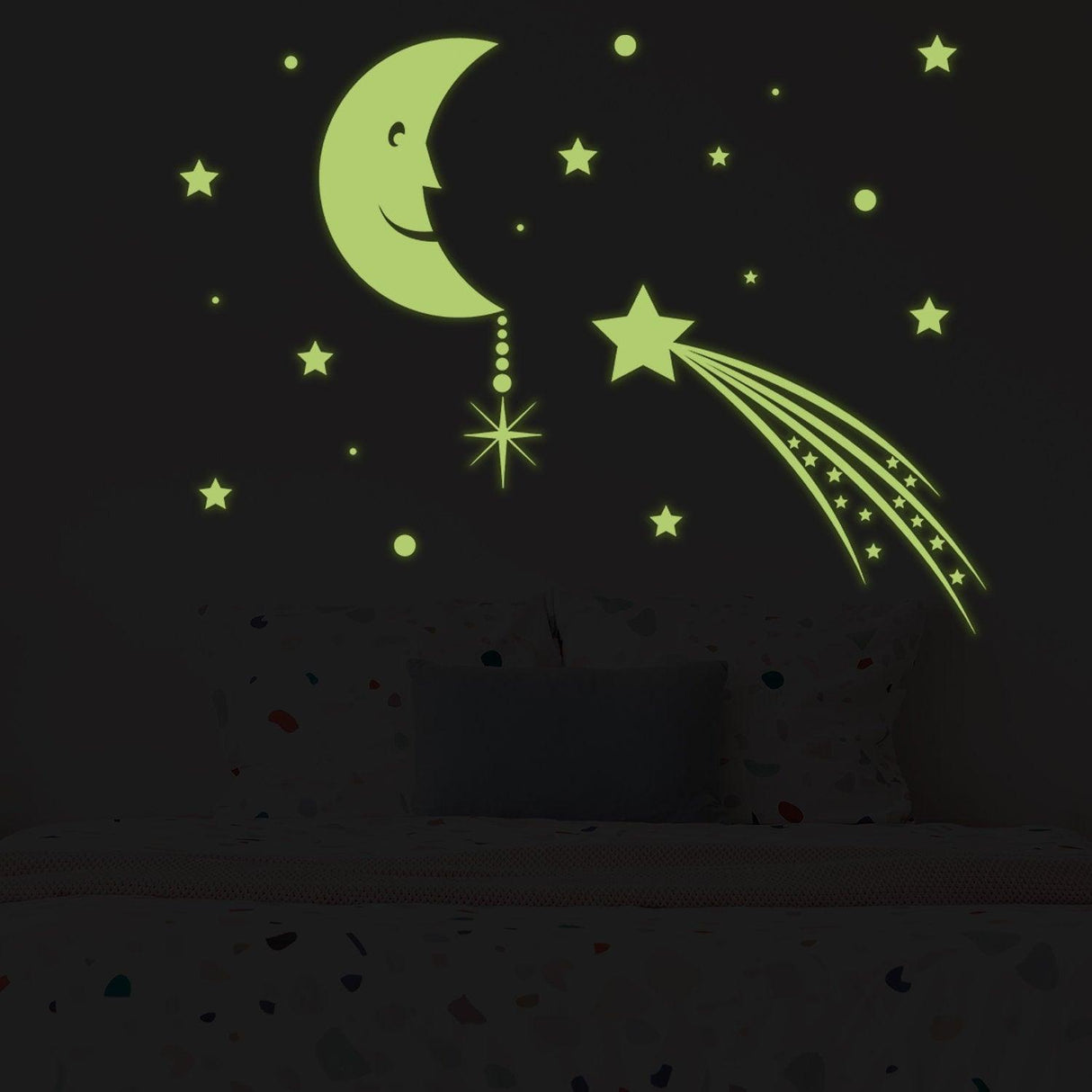 Glowing moon and stars sticker in dark bedroom, creating a magical glow-in-the-dark atmosphere.
