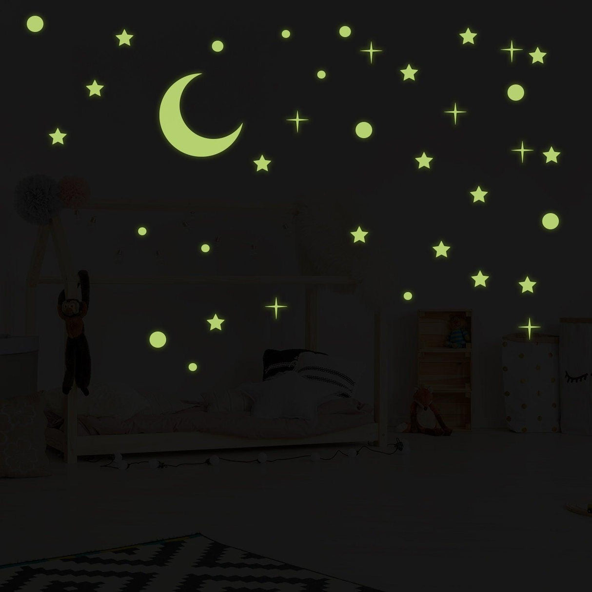 Glowing ceiling stickers of stars and a moon, perfect for creating a starry sky in children's rooms.