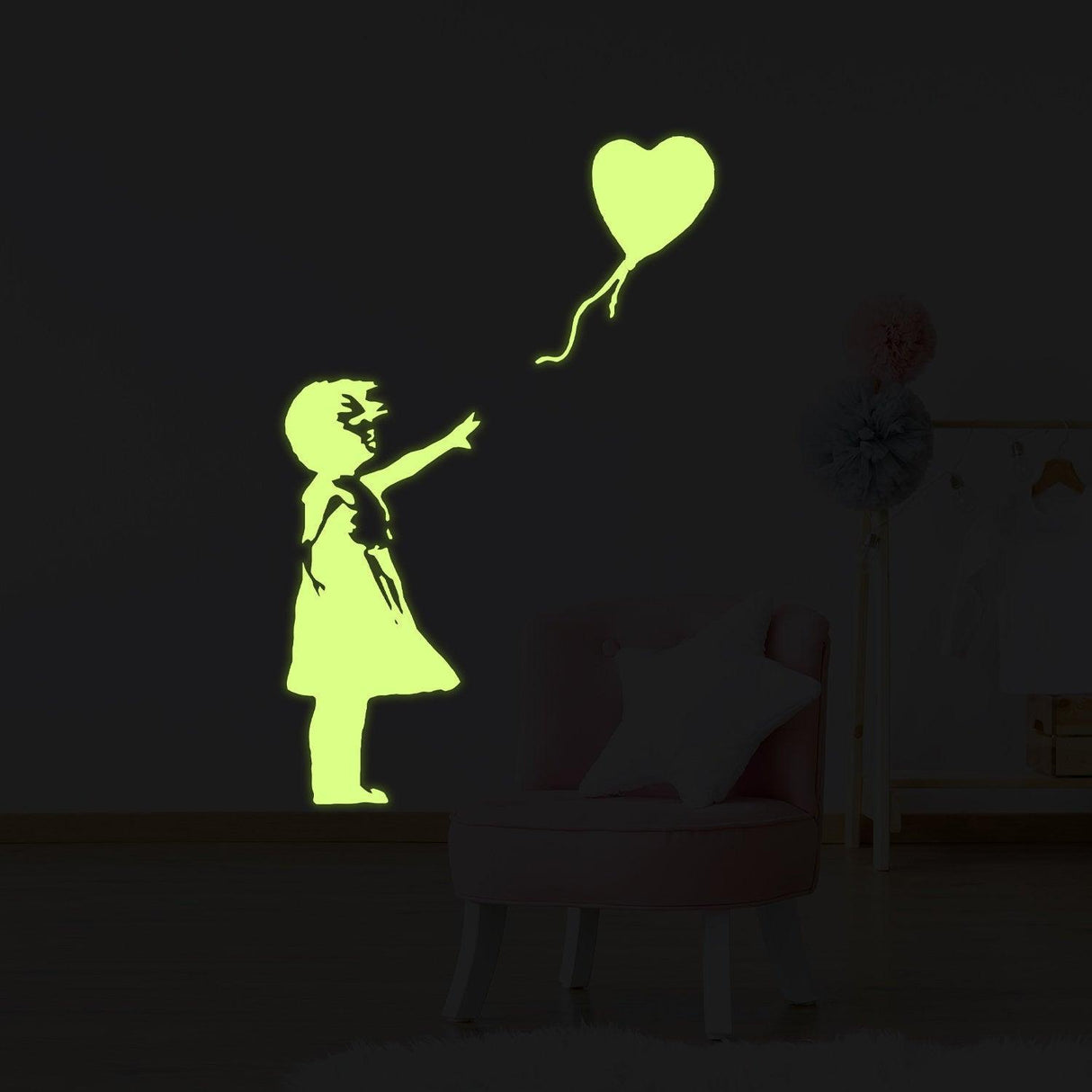 Glow in the dark vinyl wall sticker art of a girl holding a heart-shaped balloon, perfect for kids' room decor.