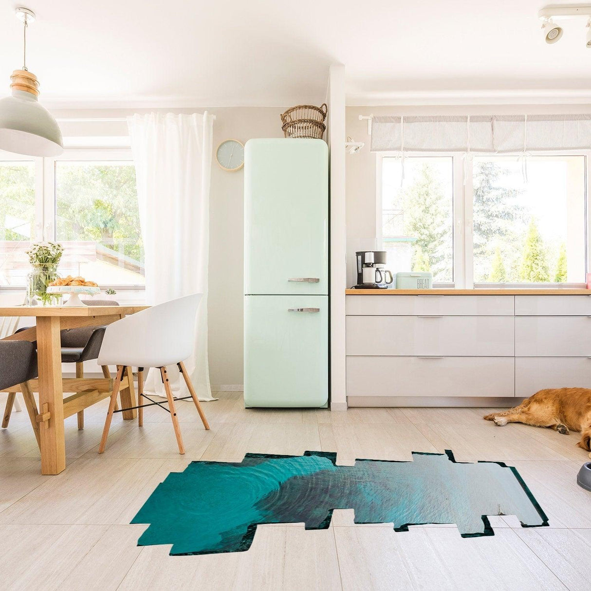 3D ocean vinyl porthole sticker on kitchen floor, creating an underwater effect in a modern home interior.