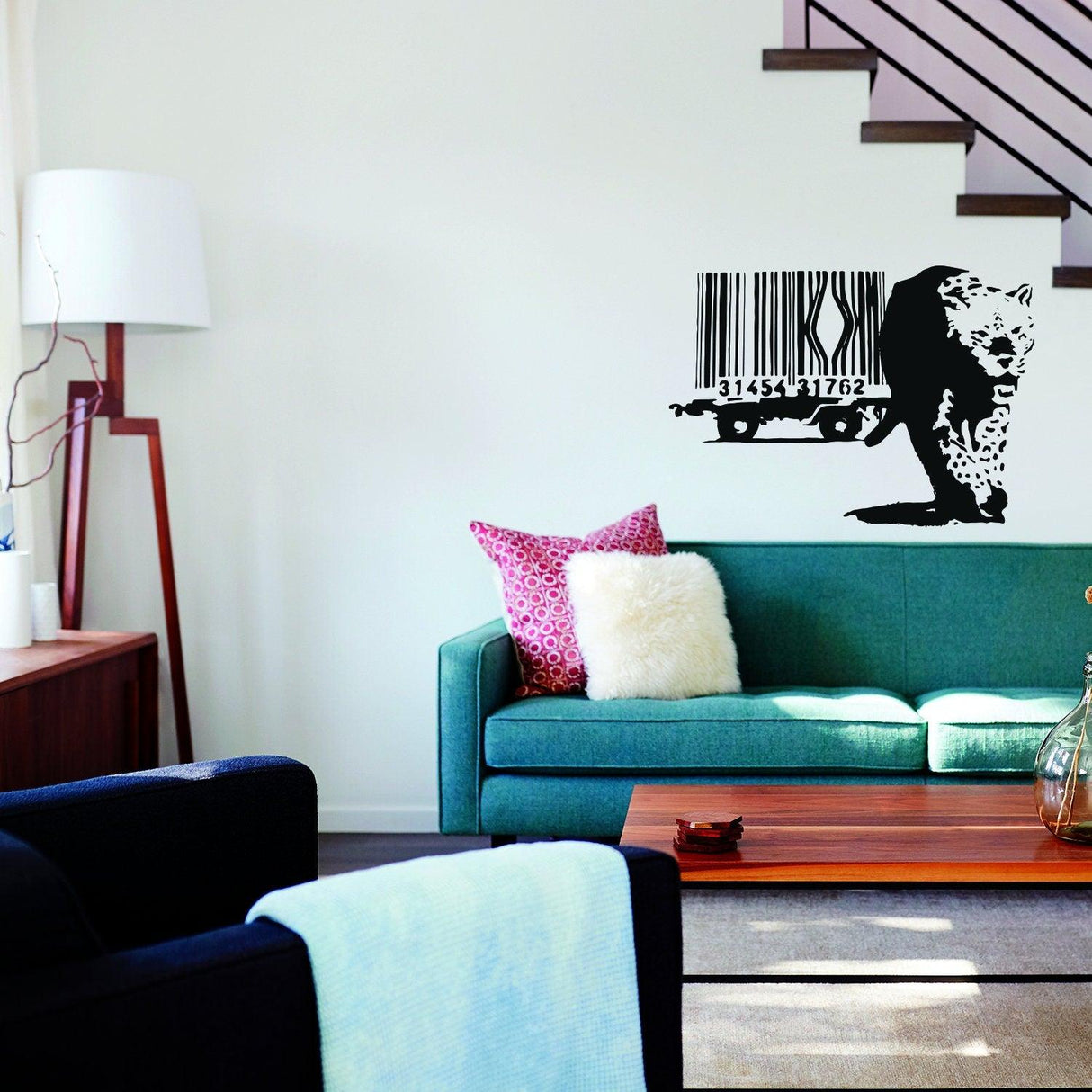 Banksy Leopard Barcode Wall Sticker on wall above green sofa, adding unique art decor to a stylish living room.