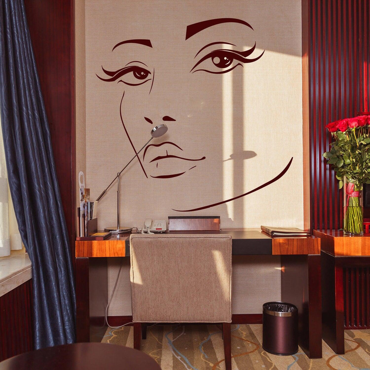 Elegant wall decal of a woman's face in a modern workspace, adding artistic flair and sophistication.