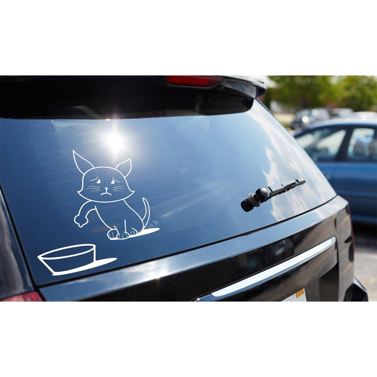 Funny cat vinyl sticker on car window, depicting a cat near a food bowl, adding humor to vehicle decor.