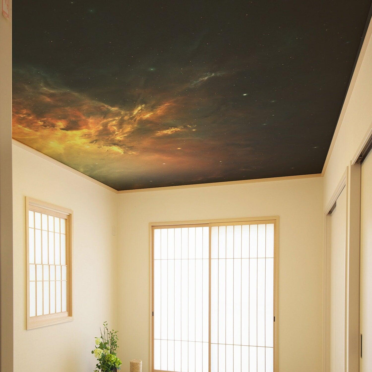 Space theme ceiling vinyl sticker with galaxy art creating a dreamy atmosphere in a bright room.
