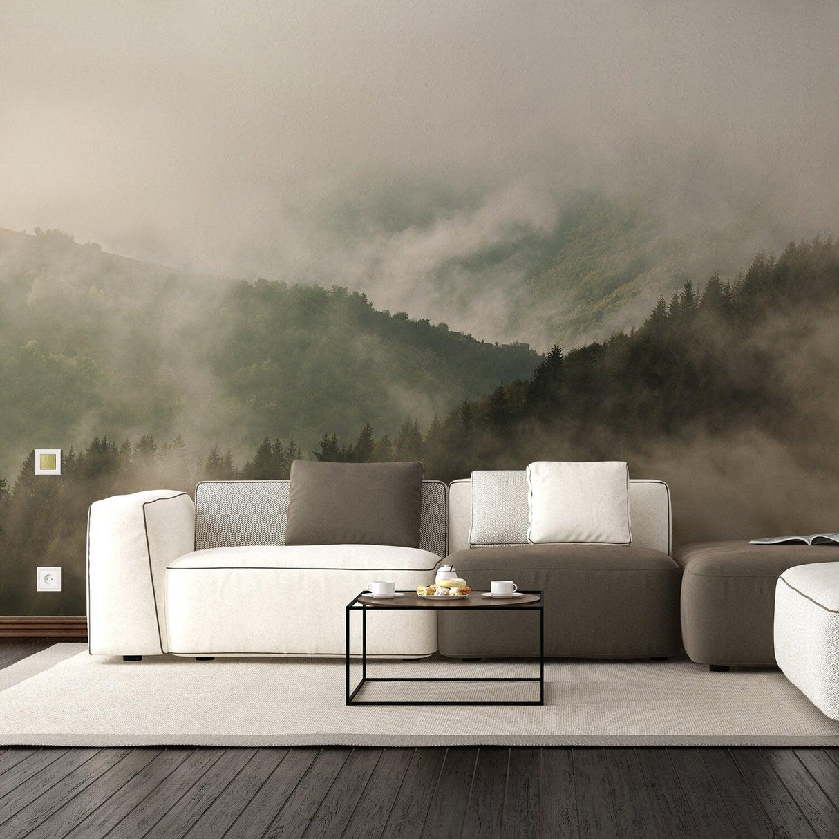Foggy forest mural backdrop with mountains, enhancing a cozy living room with modern furniture.