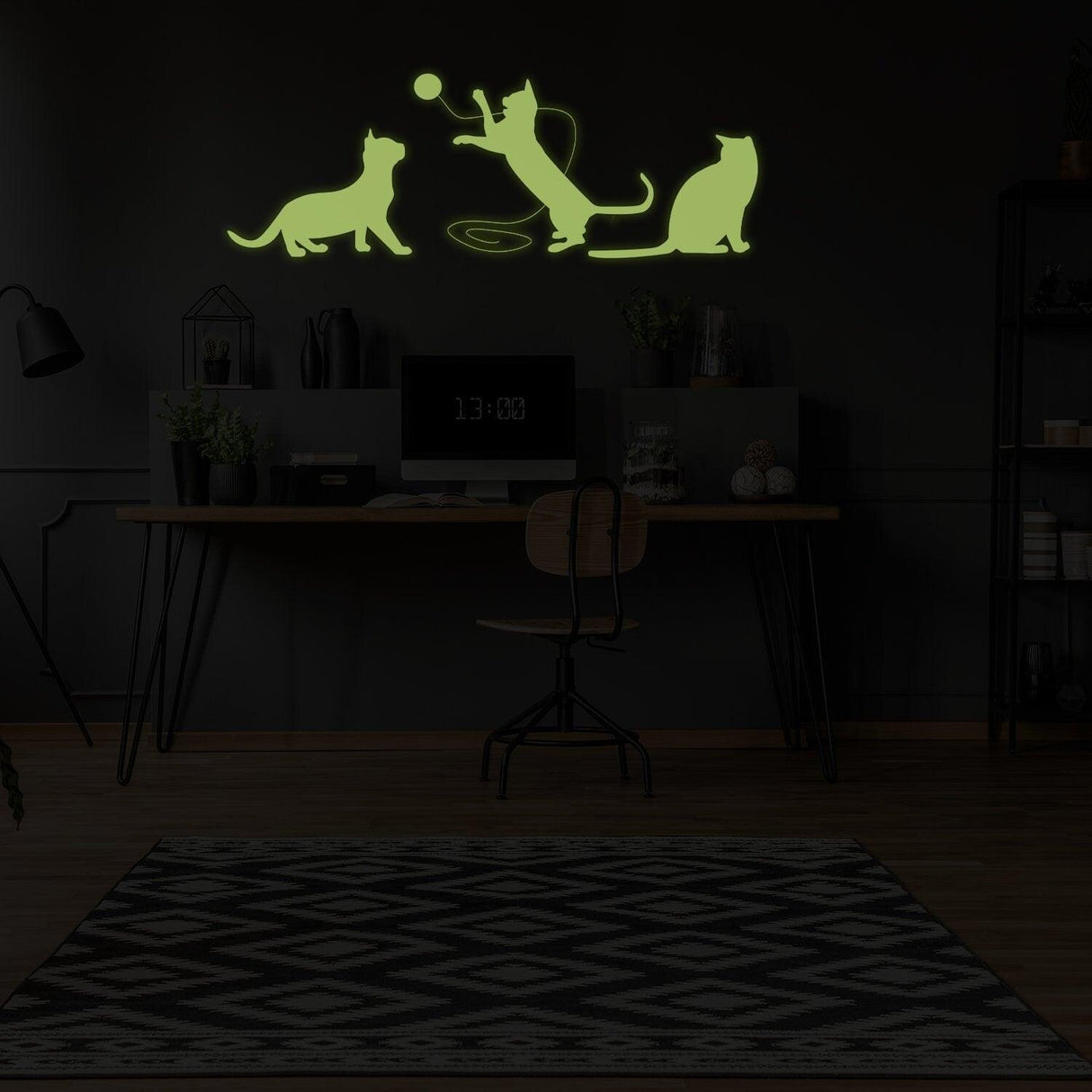 Glow in dark vinyl wall sticker of playful cats in a cozy room setting, adding whimsical charm to any space.