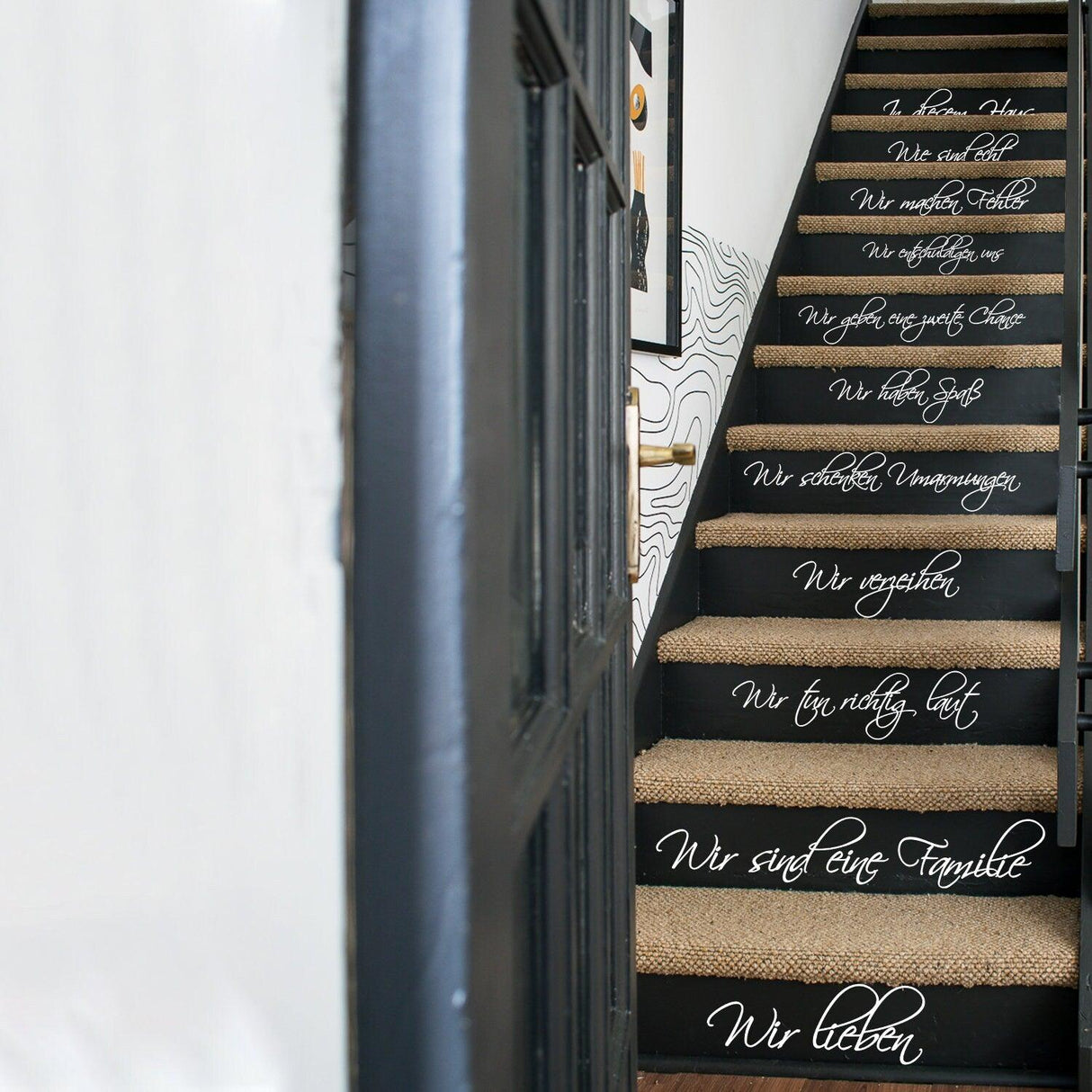 Vinyl wall sticker on stairs with family quote promoting love and unity in the home decor.