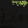 Glow at Night Decal Branch Wall Sticker with glowing flowers and butterflies in a kids' bedroom setting.