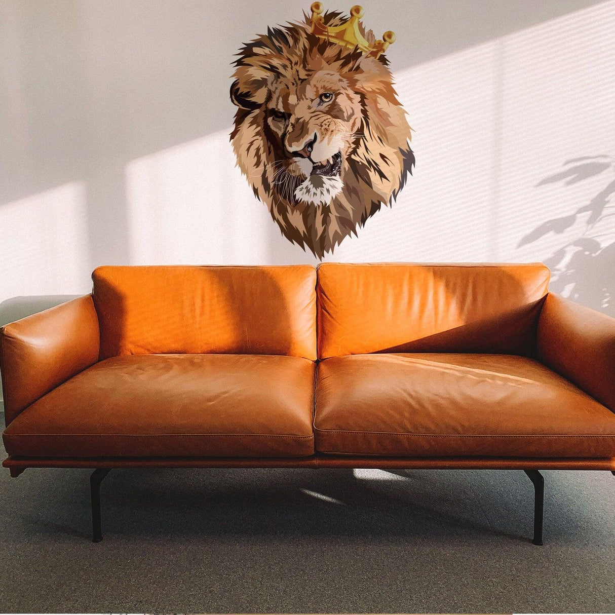 Lion King vinyl wall sticker above a modern brown leather couch in a sunlit room.