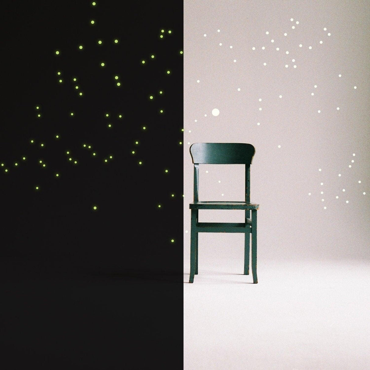 A dark room with luminescent stars on one side and a minimalist green chair in the center, creating a magical ambiance.