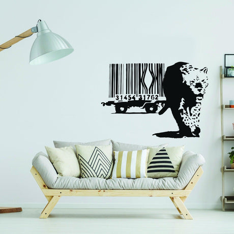 Banksy Leopard Barcode Wall Sticker on a living room wall above a modern couch with decorative pillows.
