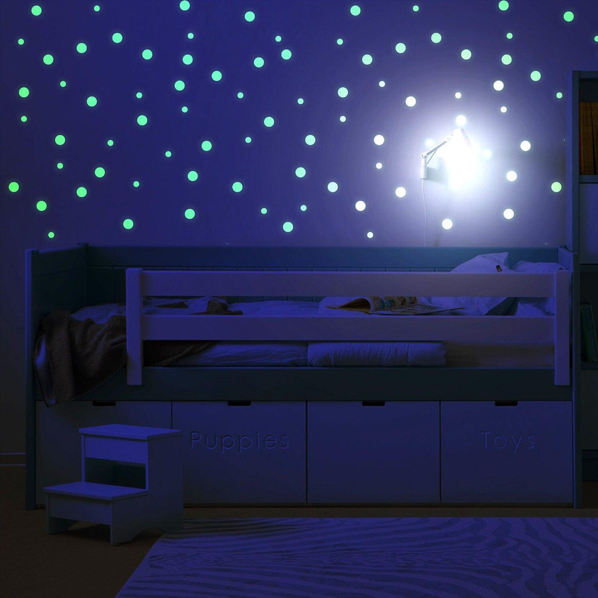 Glow in the dark circle stars wall stickers illuminating a child's bedroom at night.
