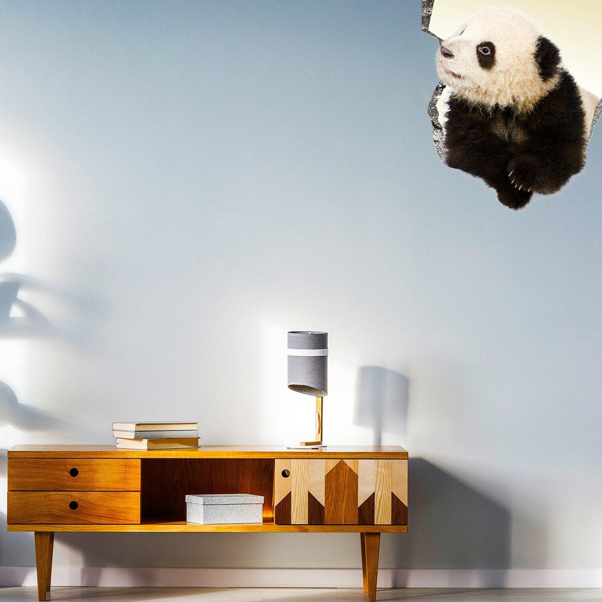 3D Art Animal Hole In Wall Sticker featuring a panda breaking through the wall, adding playful decor to any room.