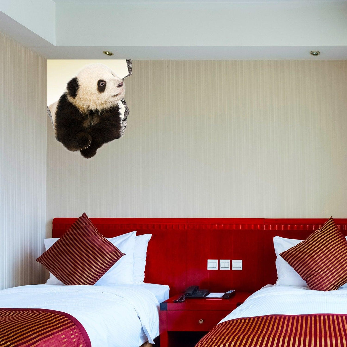 3D vinyl panda wall sticker creating a broken wall illusion in a stylish bedroom with two beds.