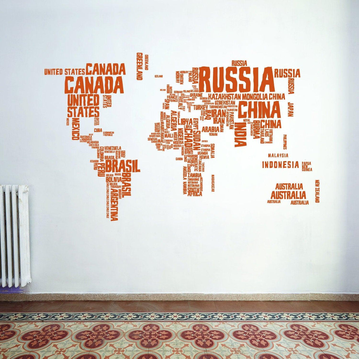 Colorful world map vinyl wall sticker with country names in playful font for kids' decor.