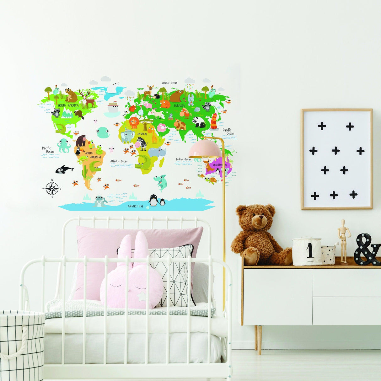 Colorful kids world map wall decal with animal illustrations in a nursery setting.