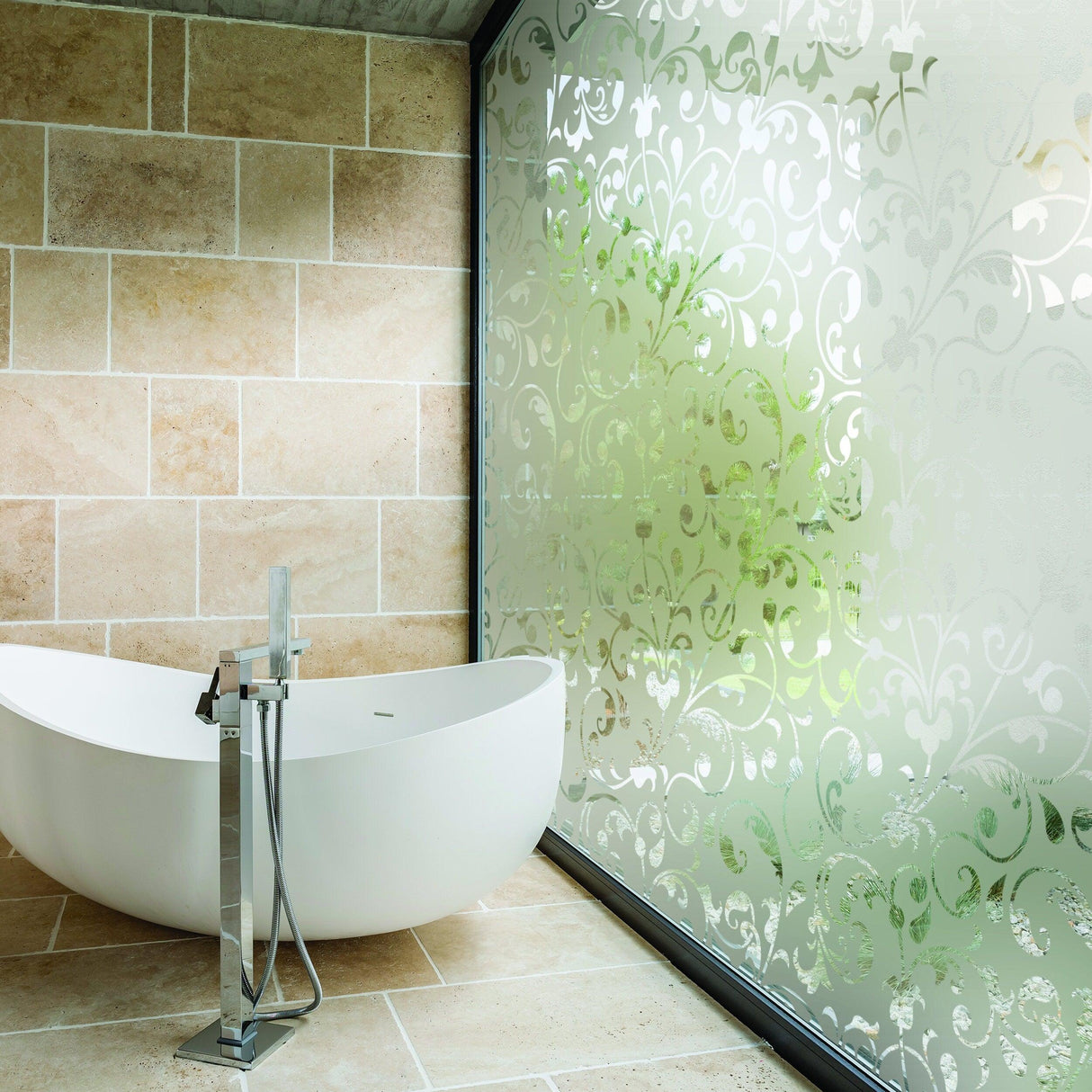 Elegant frosted vinyl decal on glass, creating a stylish bathroom with a modern bathtub.
