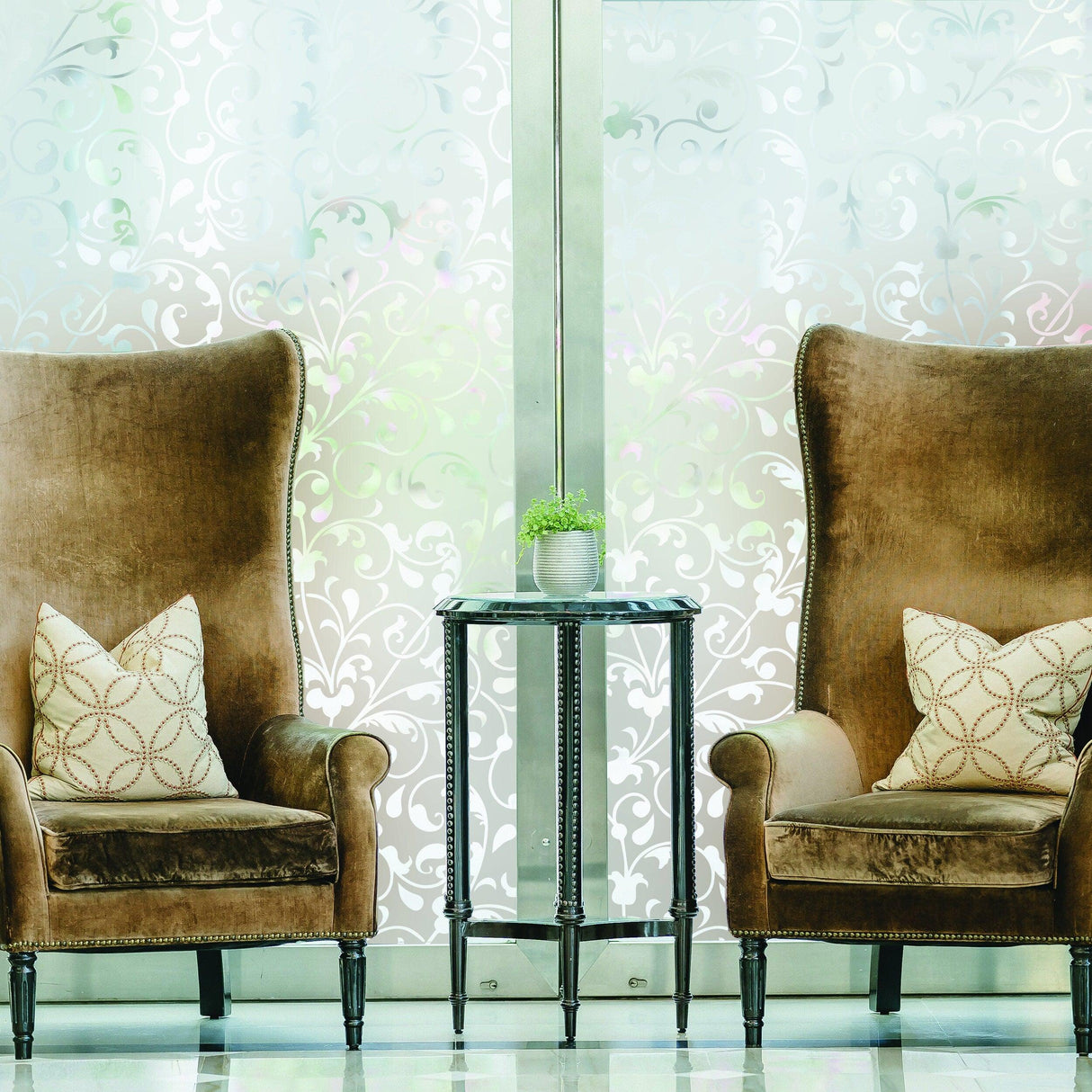 Elegant frosted window vinyl decal enhancing a cozy seating area with two ornate chairs and a small table.