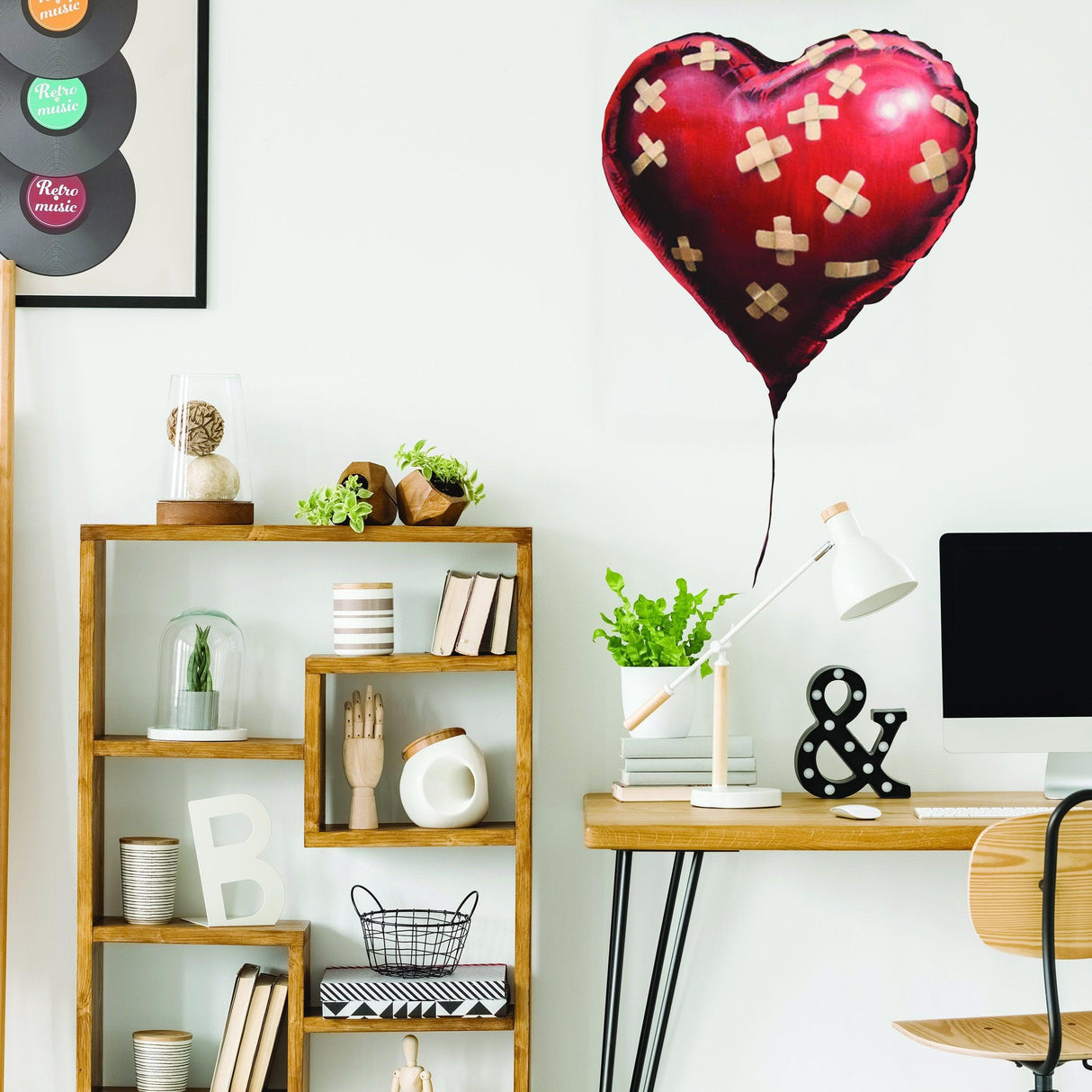 Banksy heart balloon vinyl wall sticker in modern home decor setting showcasing stylish shelf and desk.