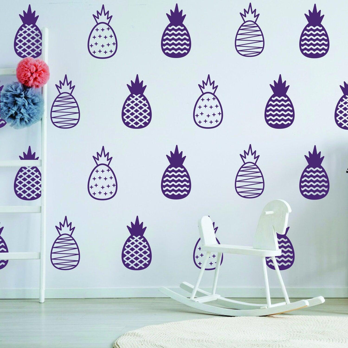 Colorful pineapple wall decals in a modern bedroom, showcasing playful designs and a cozy atmosphere.