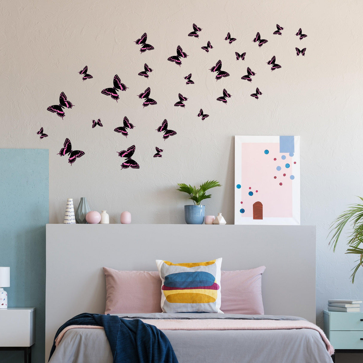 30 butterfly wall decor stickers set against a bedroom wall, adding charm to a girl's room decor.