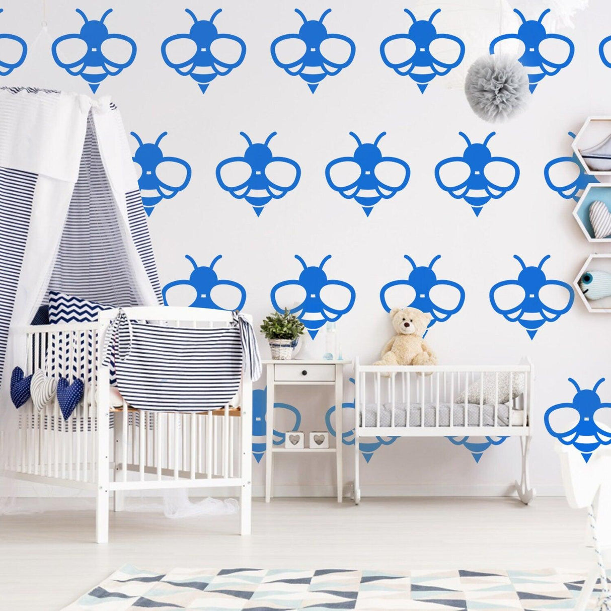 Blue bee wall stickers in a nursery, adding charm and nature-inspired decor to the room.