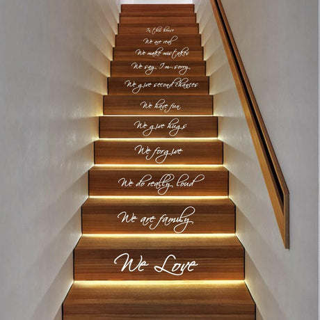 In This House quote staircase decals showcasing inspirational messages on wooden steps.