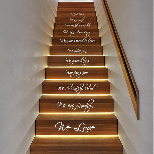 In This House quote staircase decals showcasing inspirational messages on wooden steps.