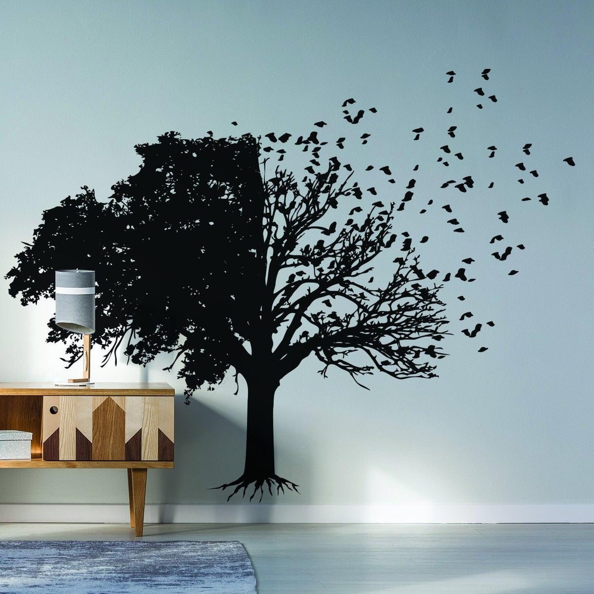Tree wall decal with birds flying, adding nature elegance to modern living room decor.