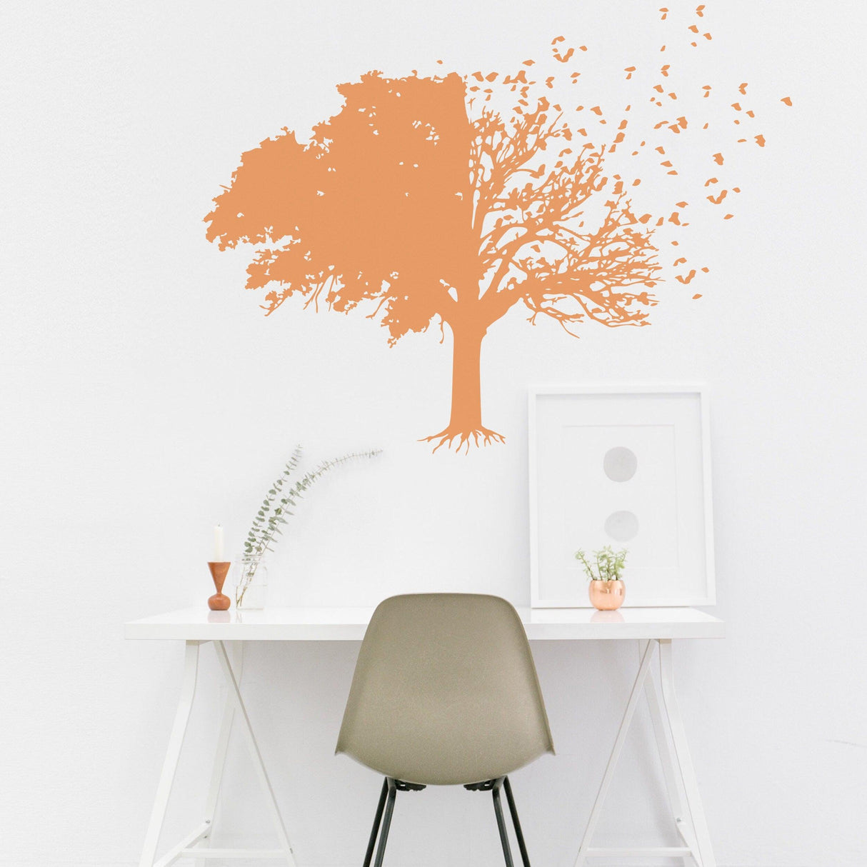 Tree wall decal in orange above a modern desk, creating a nature-inspired decor for home spaces.