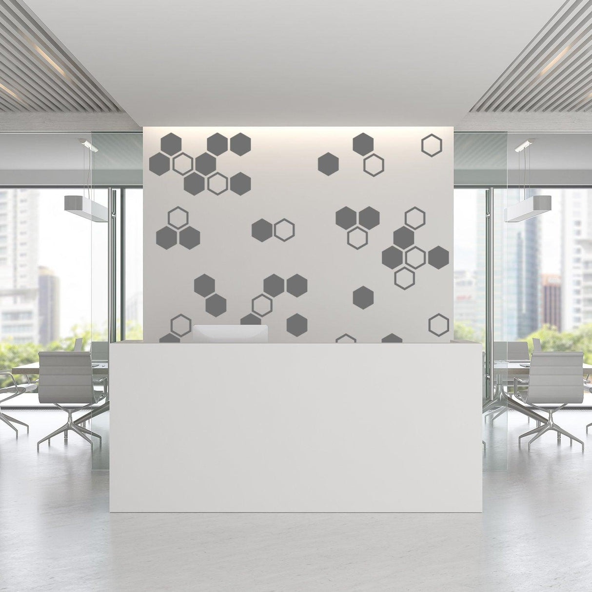 Modern office reception with gray honeycomb wall decals, featuring geometric hexagon design for stylish decor.