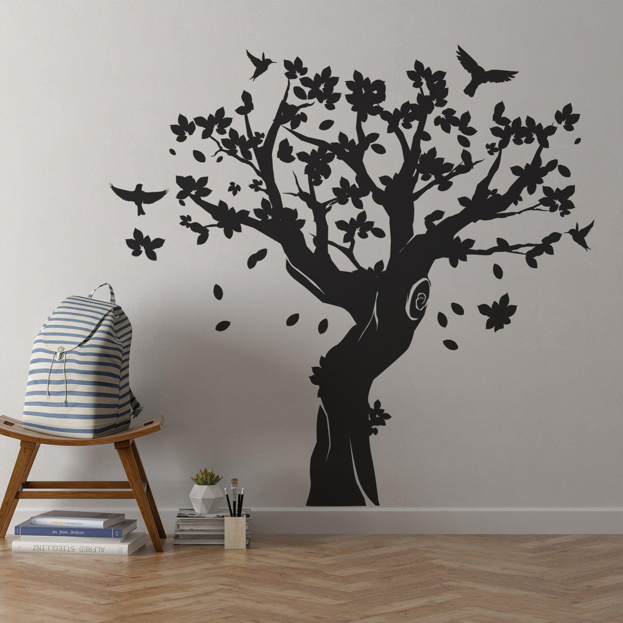 Large black tree wall decal with birds and flowers in kids room, perfect for nursery decor.