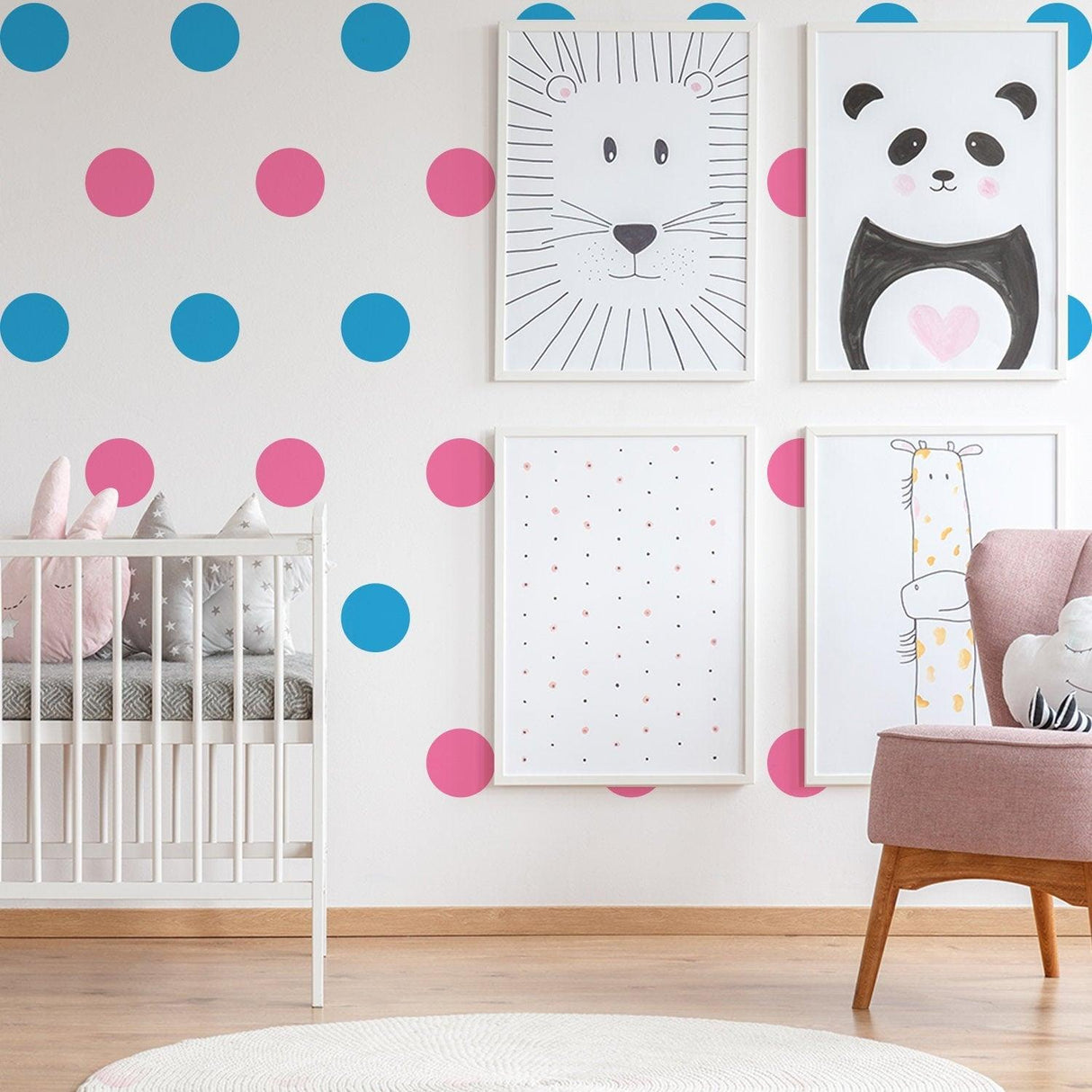 Colorful vinyl wall decals in a kids nursery with blue and pink dots, featuring cute animal art and a cozy crib.