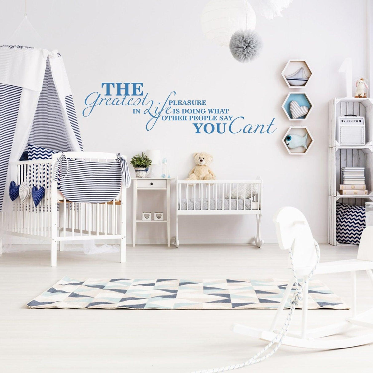 Wall quotes decal in a modern nursery, featuring an inspirational quote in blue vinyl.