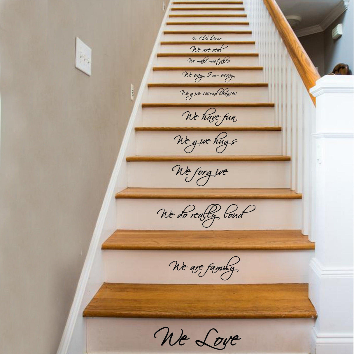 Staircase featuring vinyl quote decals saying 'In this house, we do...' adding inspiration to home decor.