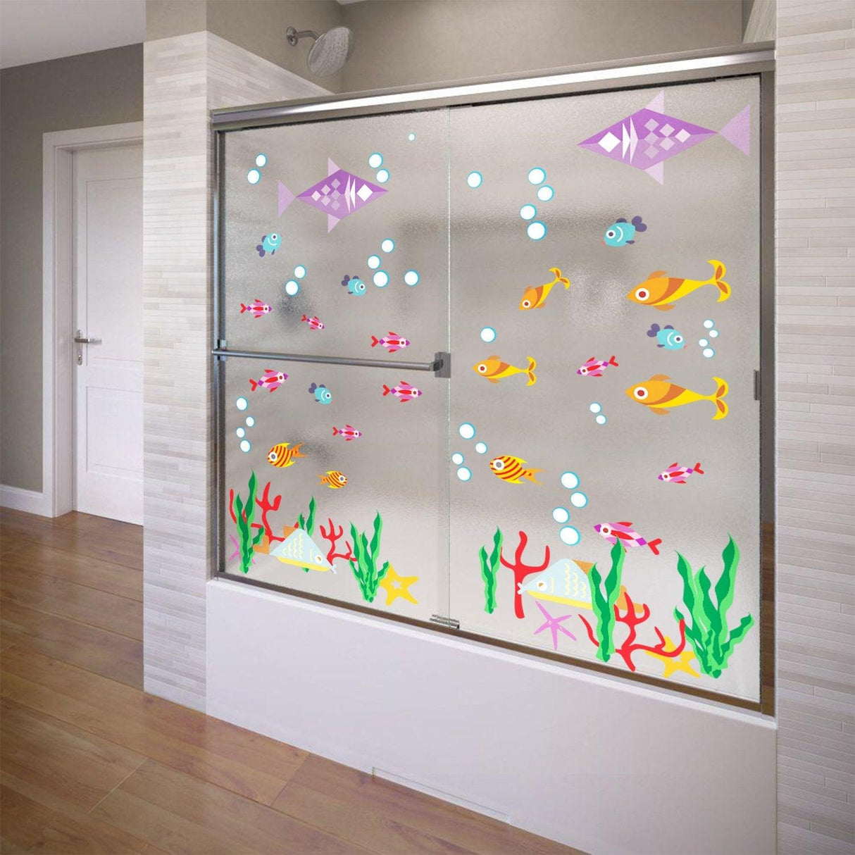 Colorful vinyl decals of fish and bubbles on a shower door, adding fun bathroom decor.