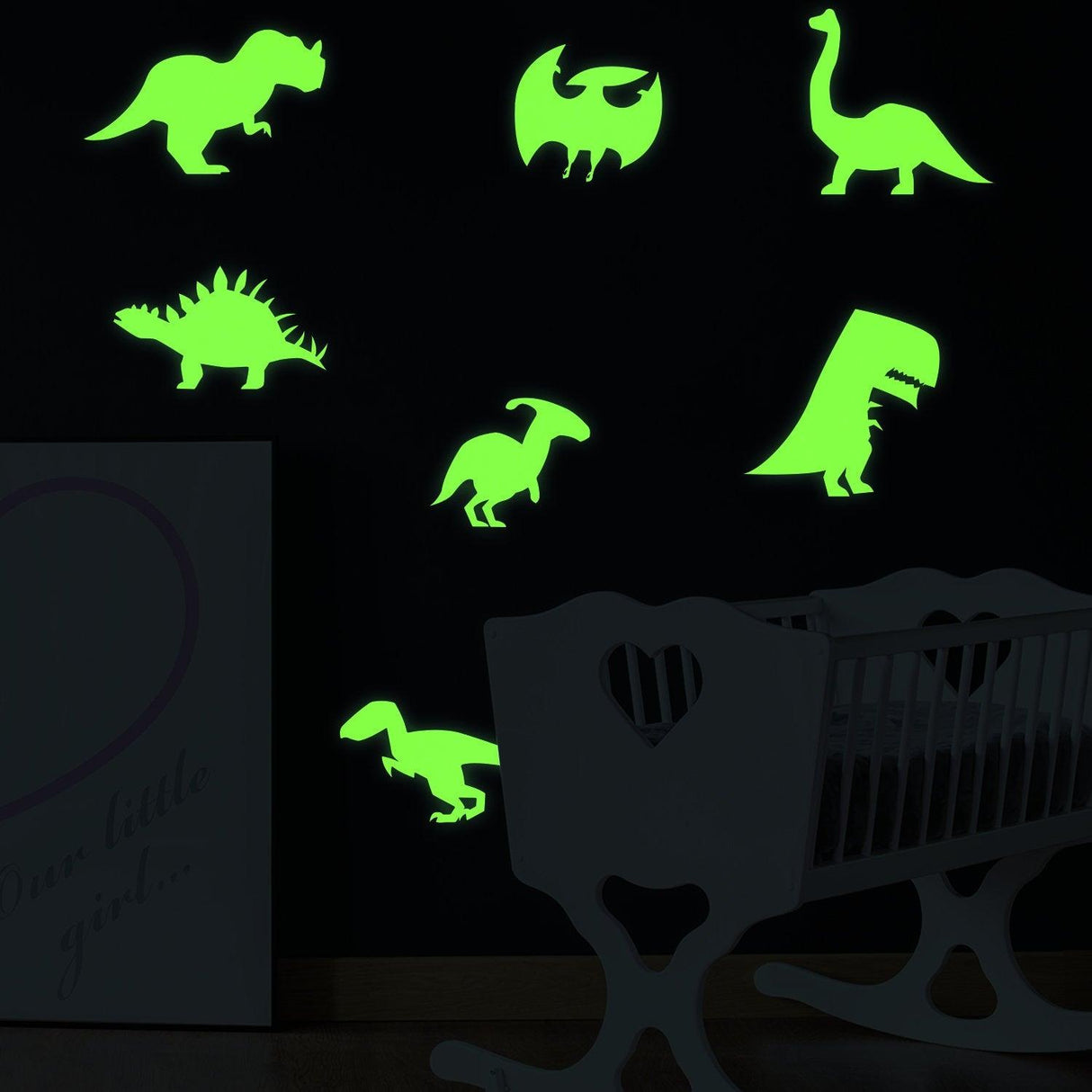 Glow in the dark dinosaur wall decals in a child's room, featuring various vibrant dinosaur designs.